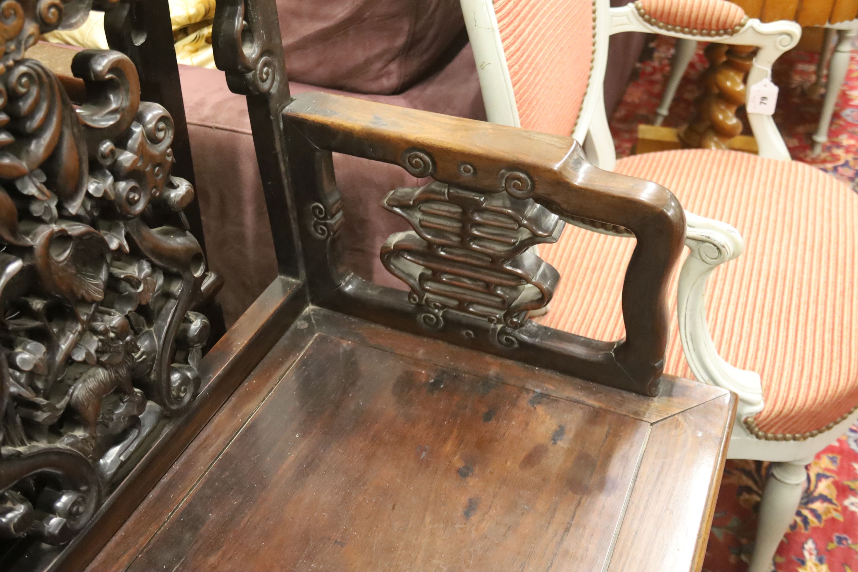 A pair of Chinese carved hongmu elbow chairs (a.f.), width 65cm, depth 48cm, height 96cm